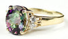 R244, 6ct Mystic Fire Topaz set in a Gold Ring w/ 4 cz accents